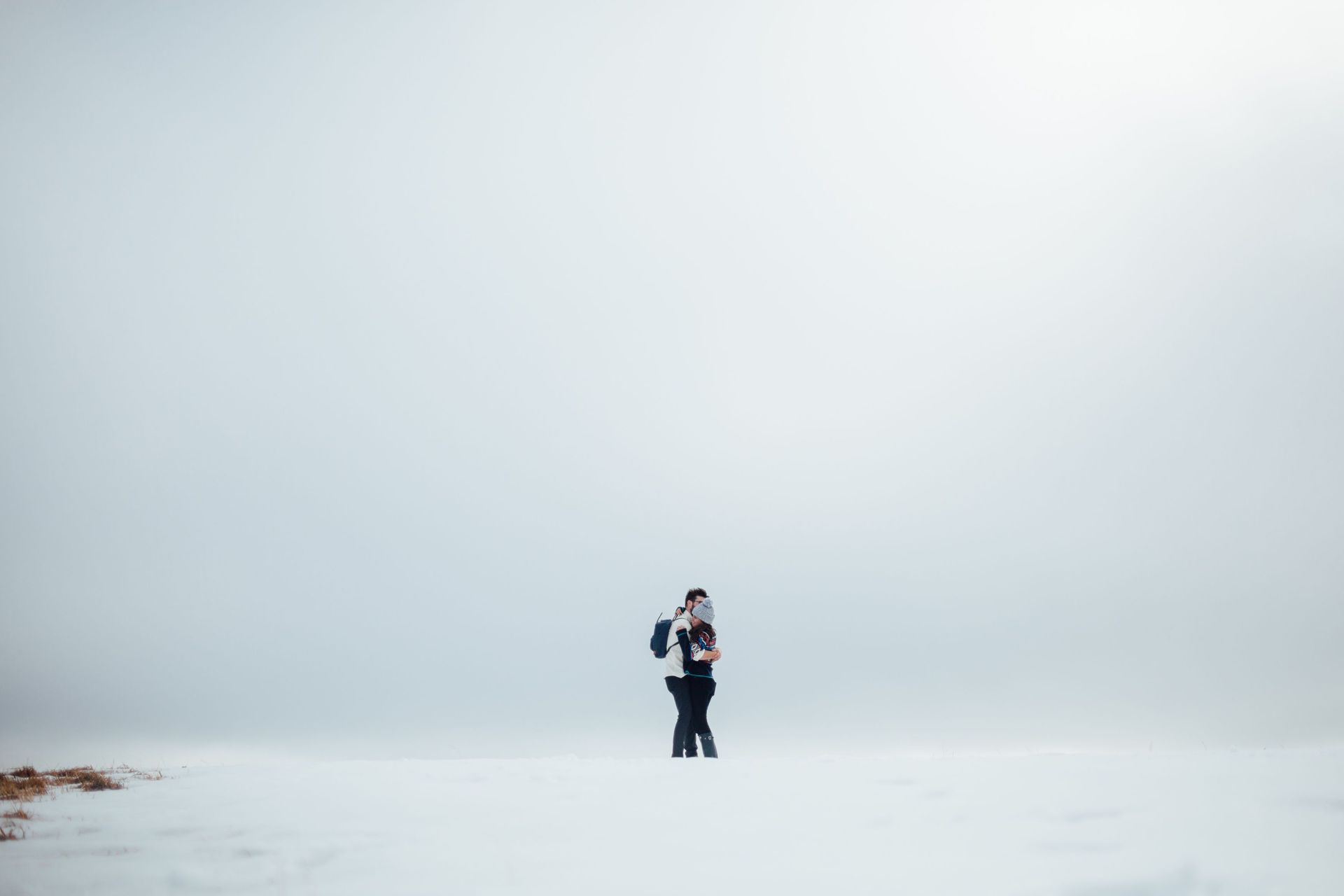 Couple hugging in the snow